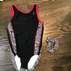 plum gymnastics leotard with matching scrunchie